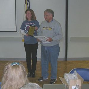 Sprout getting a TGCC Service Award Plaque from Hawkeye Mark