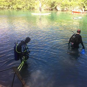 Divers enter the water