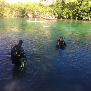 Divers enter the water