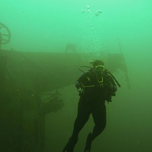 Ms K-Jenn Dives by East Wing of the Oriskany