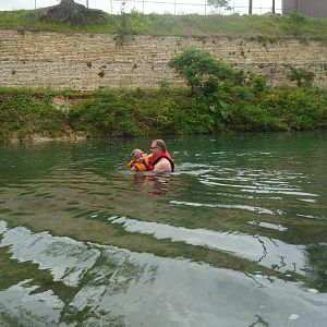 Giles and his daughter in the river