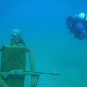 Siren Checks Out Armoured Man - JAN Blue Lagoon