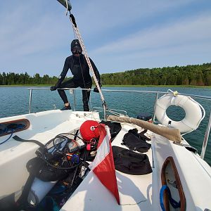 Aug DAM CHUM - Siren Climbs Back Into Sailboat