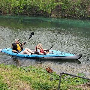 Volans and Vivie paddle their way from their campsite to ours