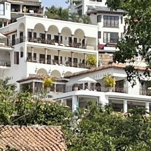 Elizabeth Taylor's house with the arches, Richard Burton's directly in front of that.