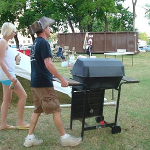 Rockfish and his daughter haul the grill