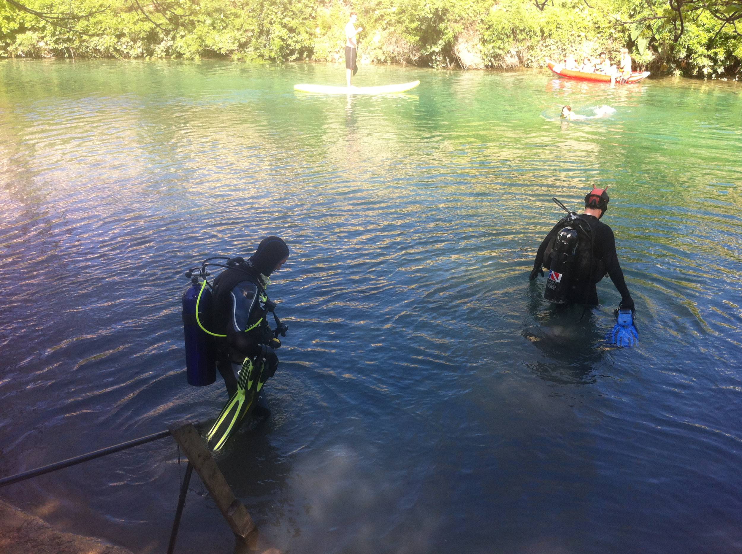 Divers enter the water