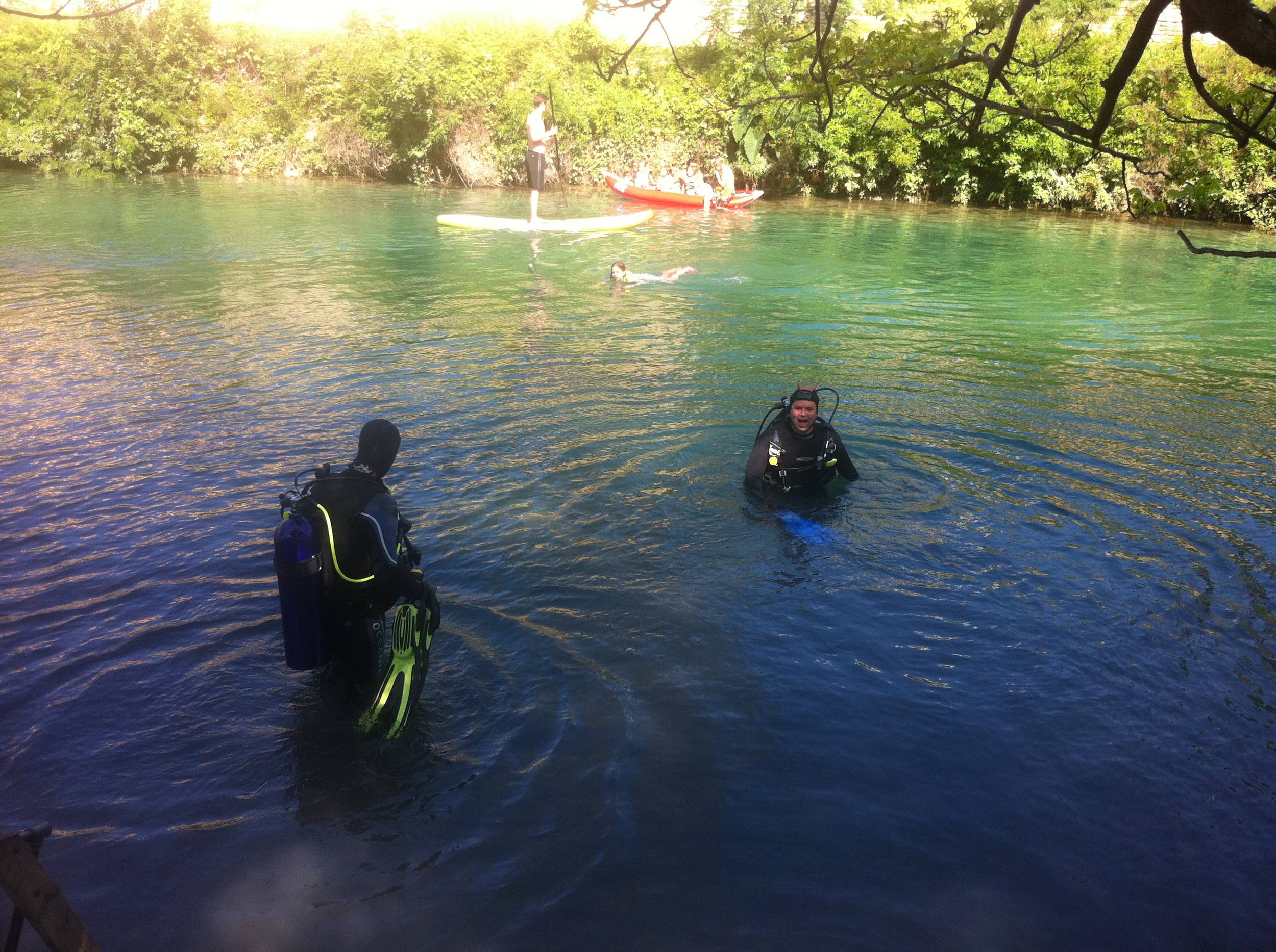 Divers enter the water