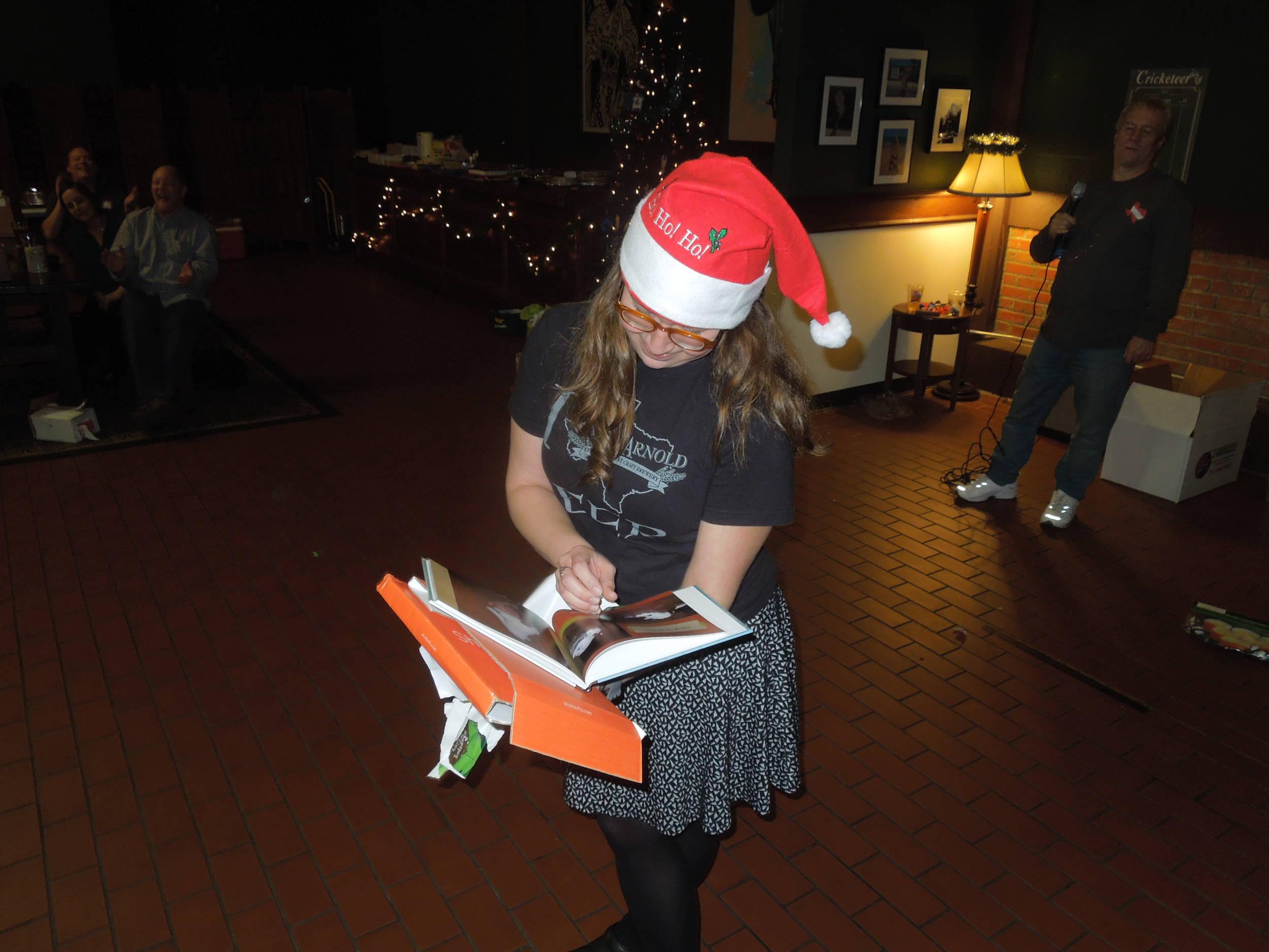 Elizabeth opens the Wet photo book