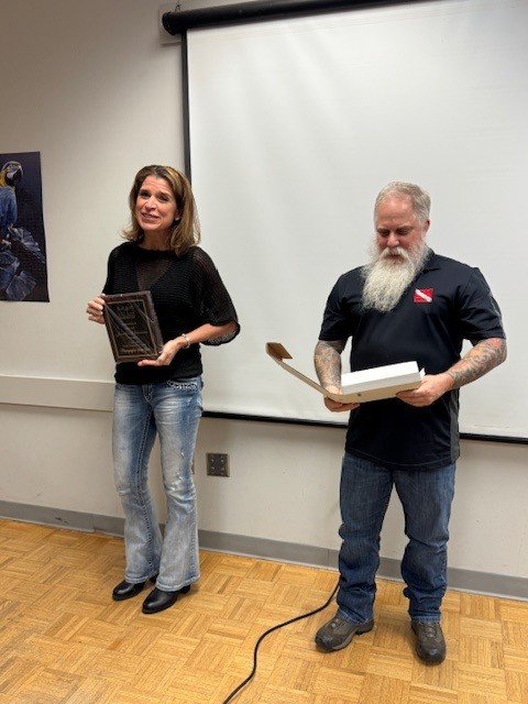 POTY Scuba Chick receiving plaque from VP Viking Diver