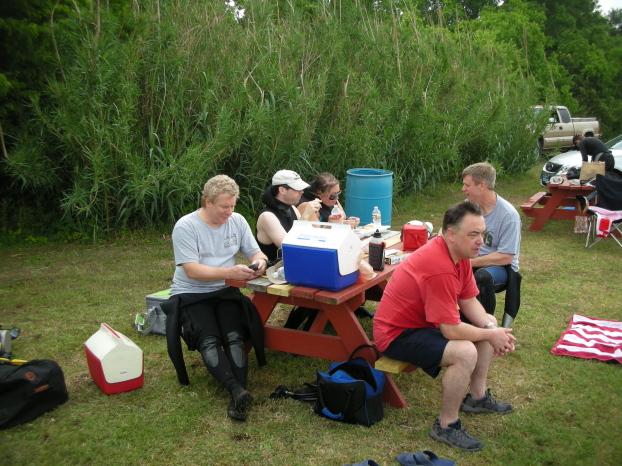 ReefHound checks the new CHUM facebook page while McLot stares angrily at t