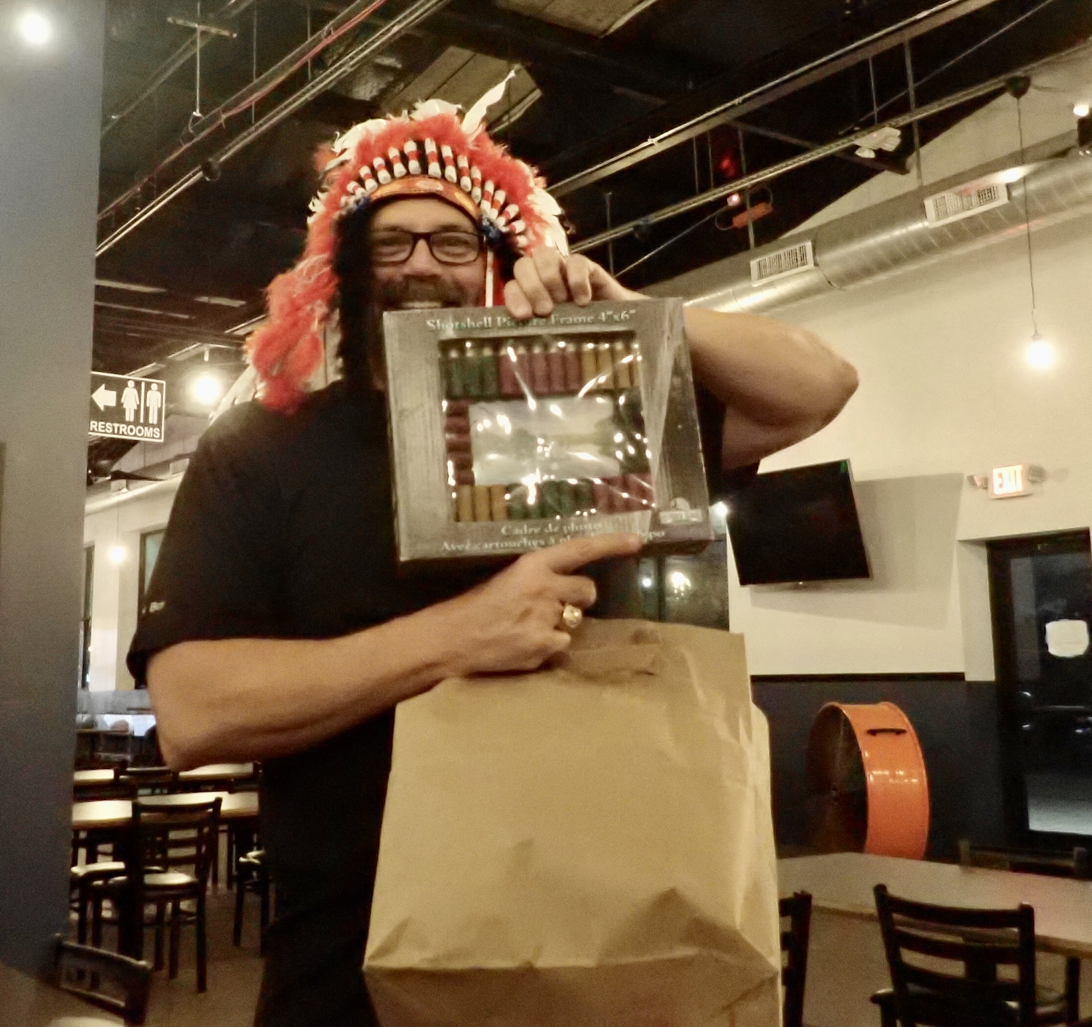 Sioux-shi Boy takes a shot at opening a gift.