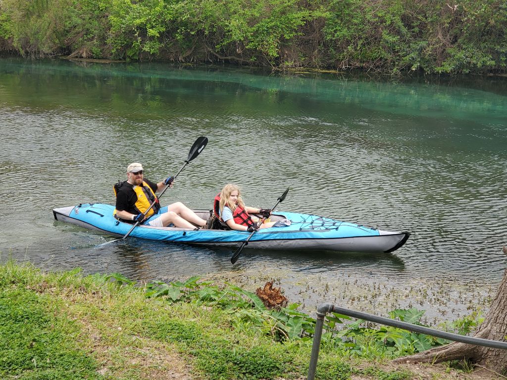Volans and Vivie paddle their way from their campsite to ours